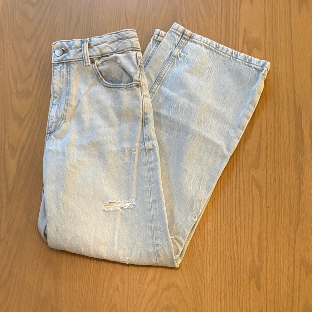 Girls light wash ripped wide leg jeans